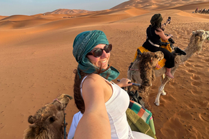 Traveller riding camel in Morocco