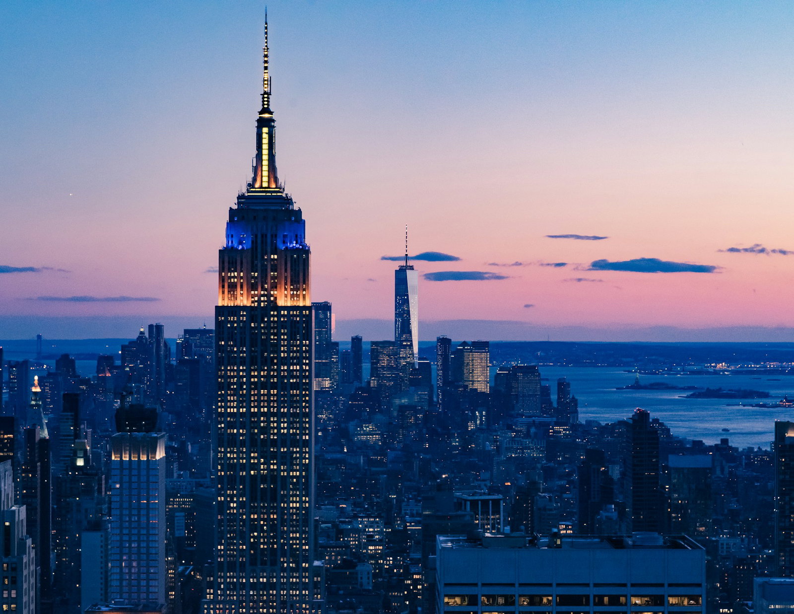 Empire State building and New York skyline at sunset