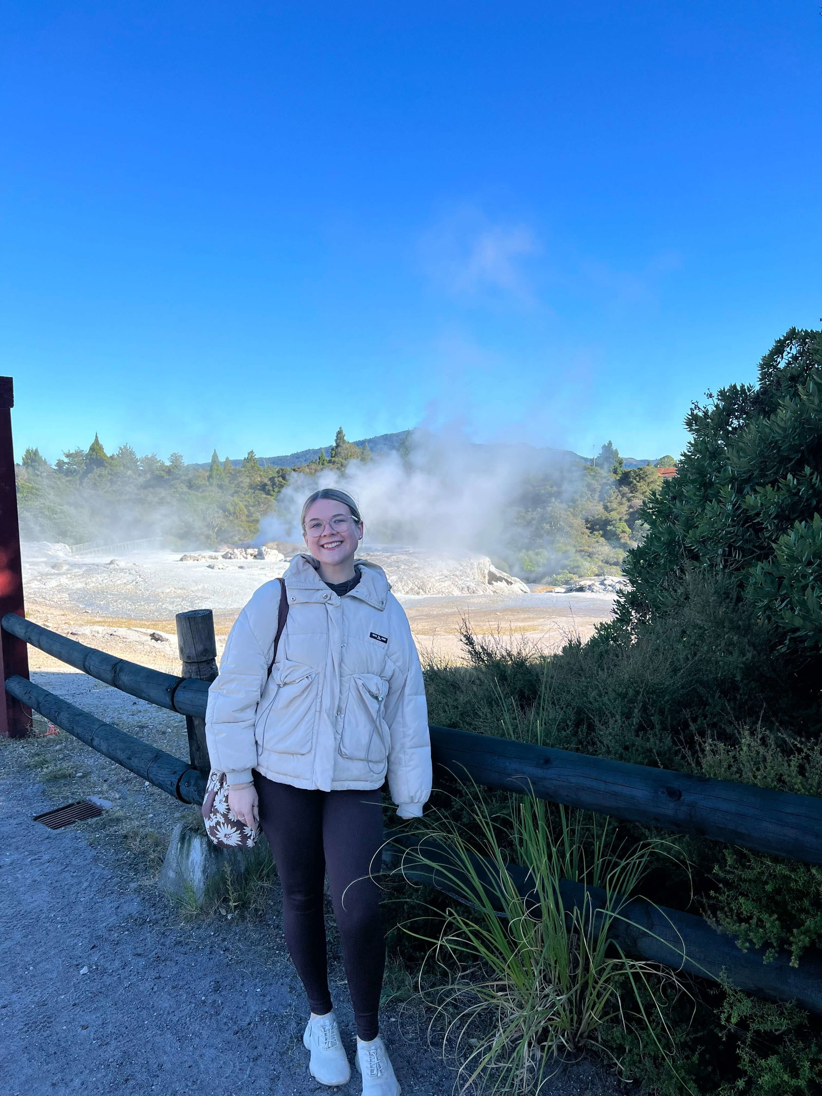 Traveller in New Zealand at Rotorua geothermal geysers