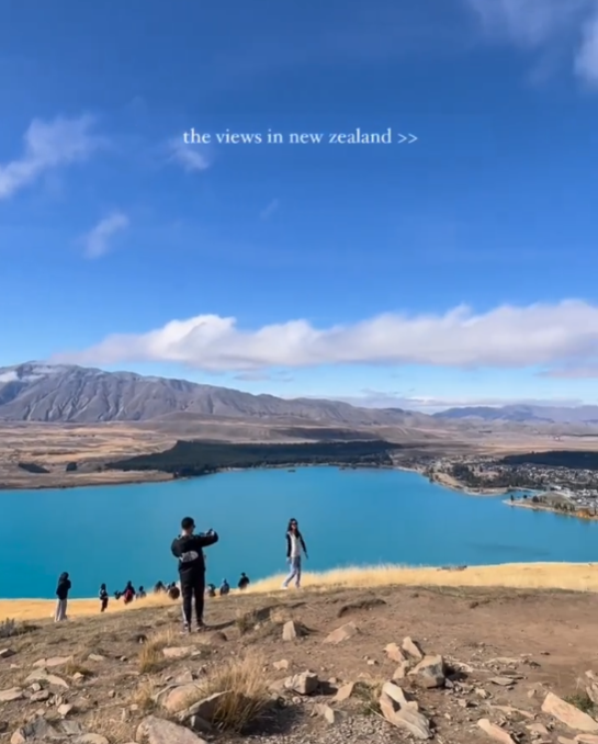 Travellers at view point in new zealand at lake Instagram post