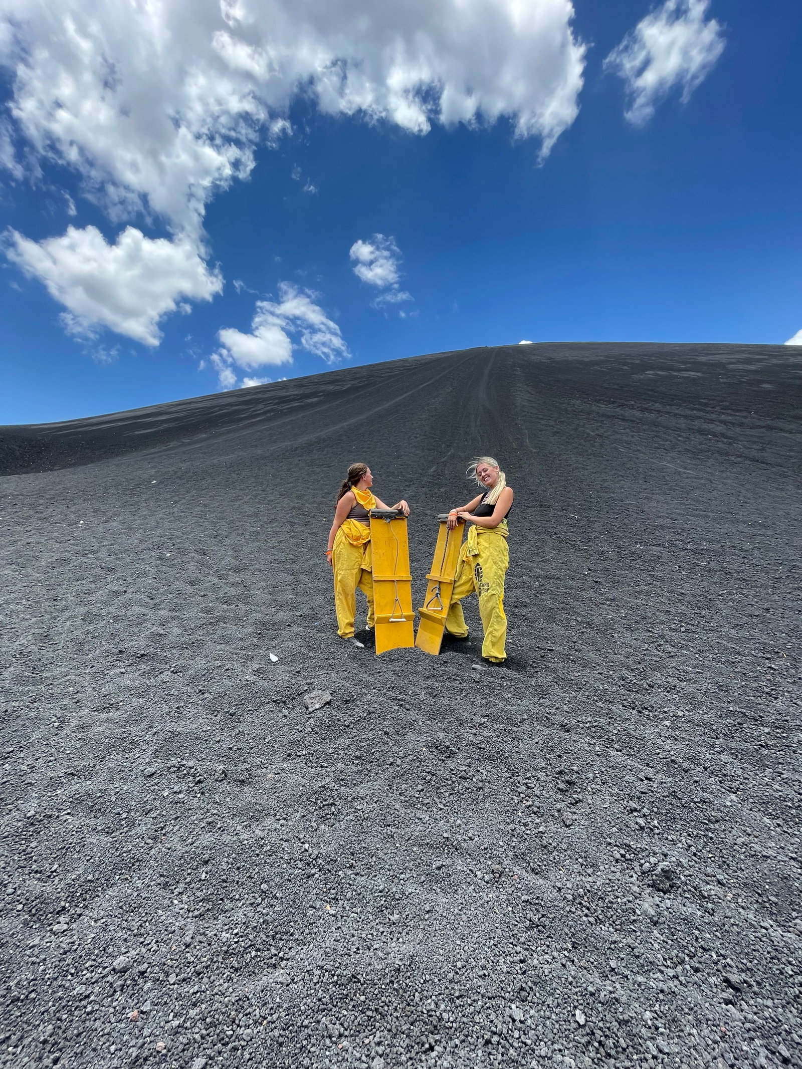 Group travellers volcano boarding in Nicaragua