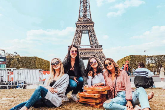 Pizza picnic in front of the Eiffel Tower