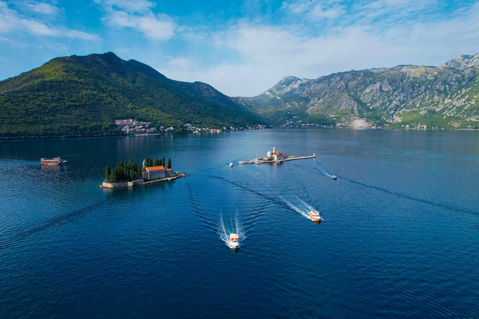 Perast Montenegro Lake and boats with mountains in background