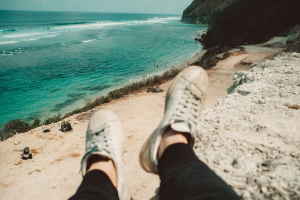 Person sitting overlooking Bali beach