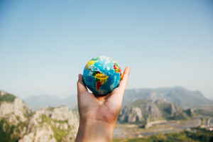 Hand holding a globe 