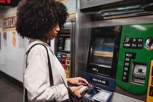 Person getting money out of atm