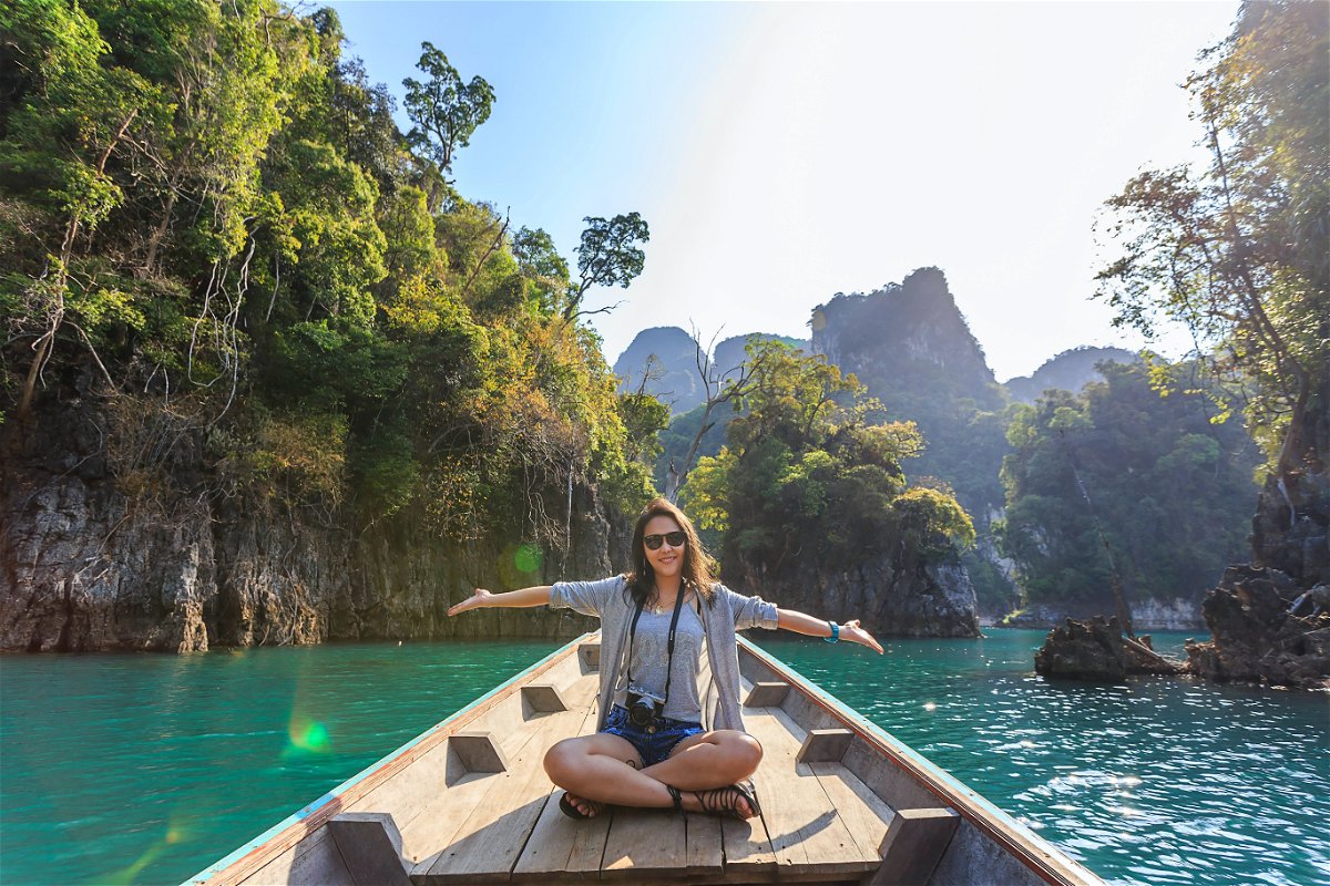 Person on a long-tail boat in Thailand