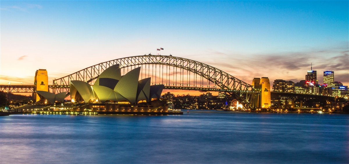 Sydney Harbour with Sydney Opera House and Sydney Harbour Bridge at sunset,  Australia