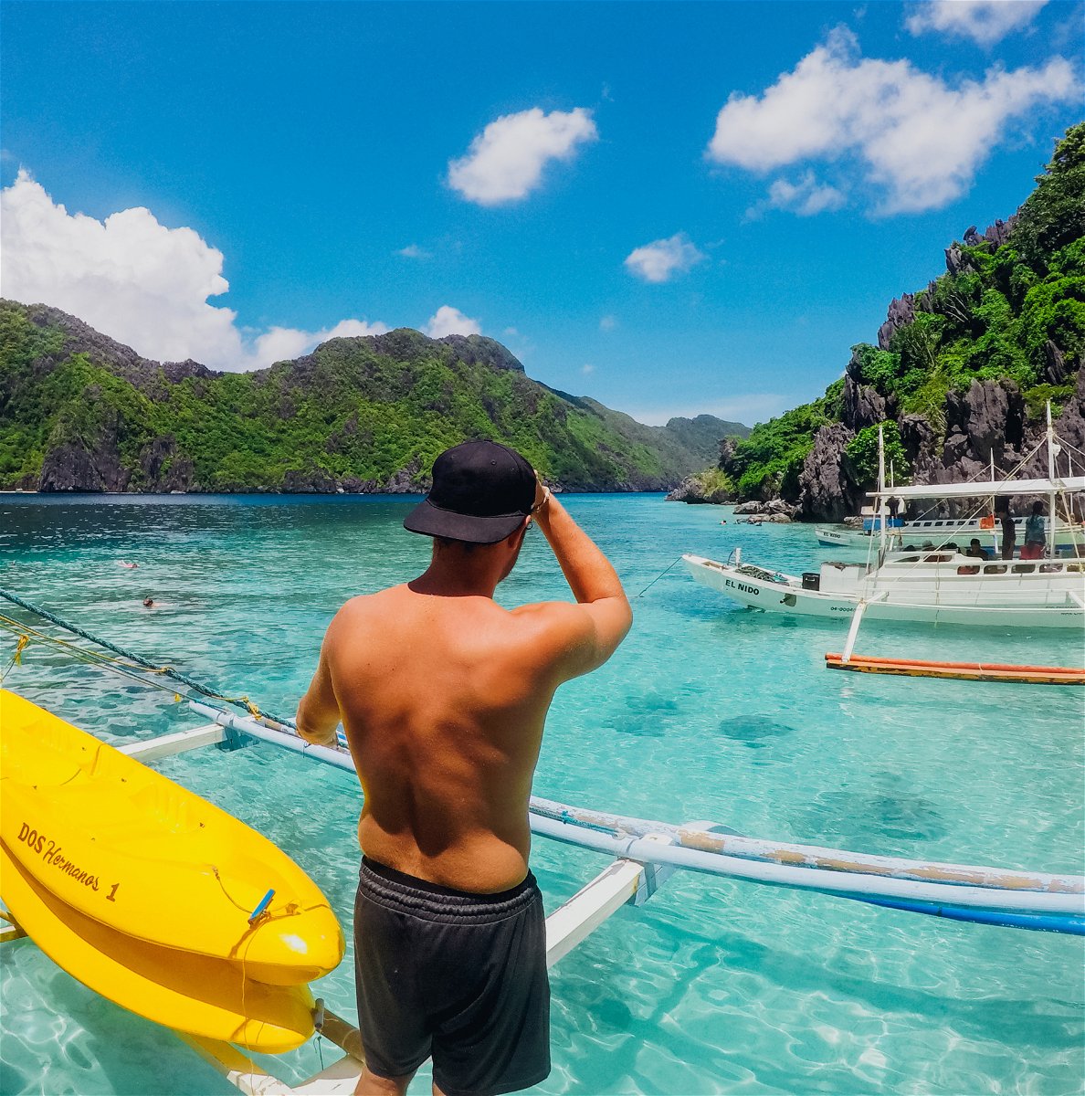 man standing on boat in philippines
