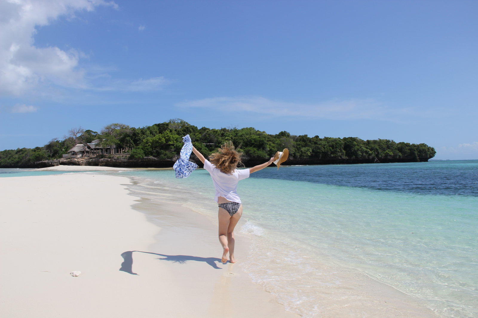 Person running on the beach on Zanzibar Island, Tanzania 