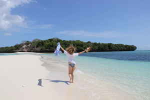 Person running on the beach on Zanzibar Island, Tanzania 