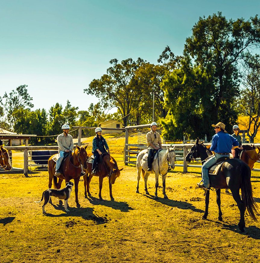 People sat on horses on Ranch farm in Brisbane Australia