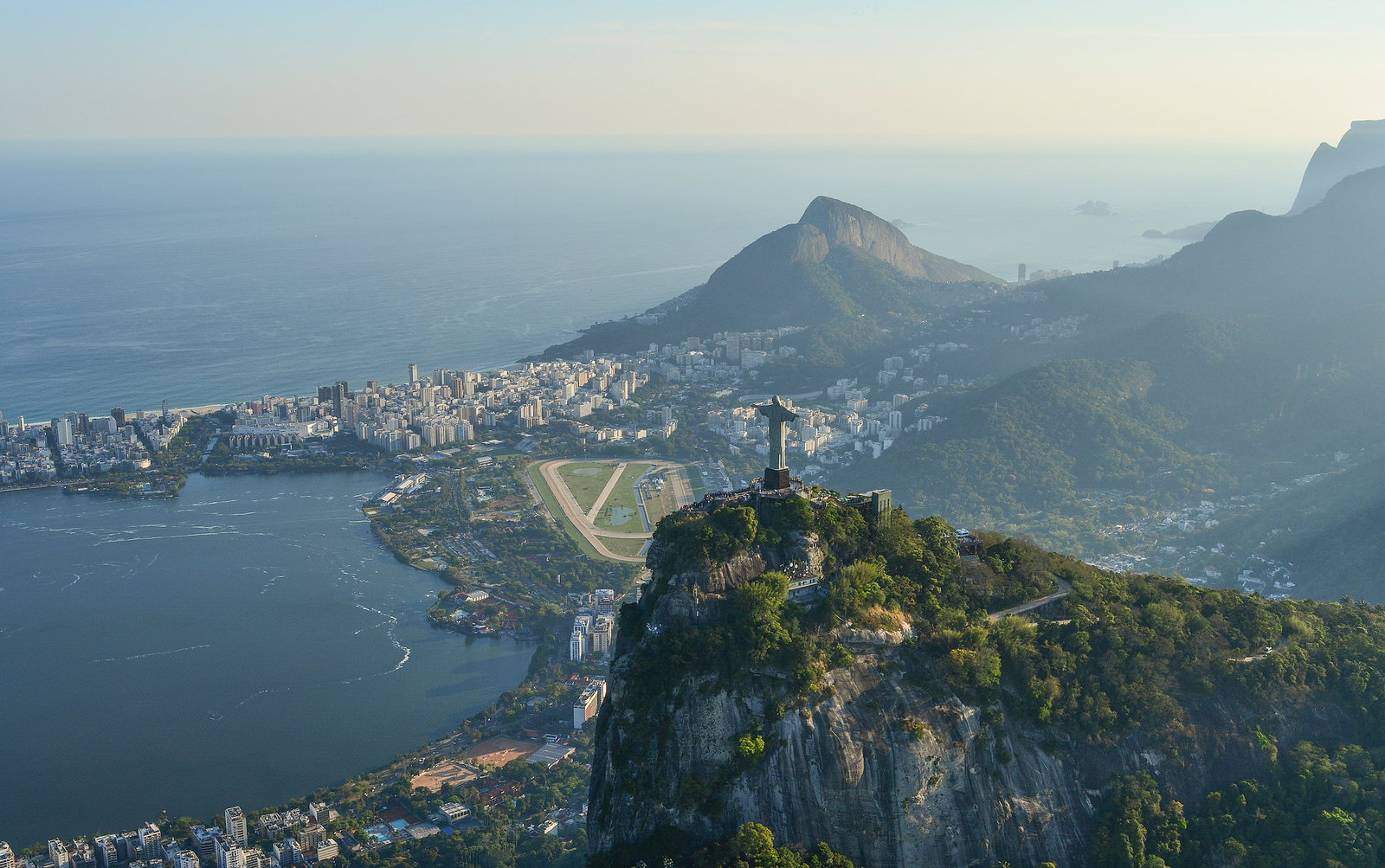 Aerial view of Christ the Redeemer and surrounding mountains and city
