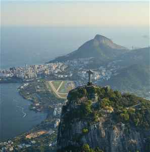 Aerial view of Christ the Redeemer and surrounding mountains and city