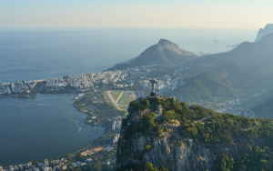 Aerial view of Christ the Redeemer and surrounding mountains and city