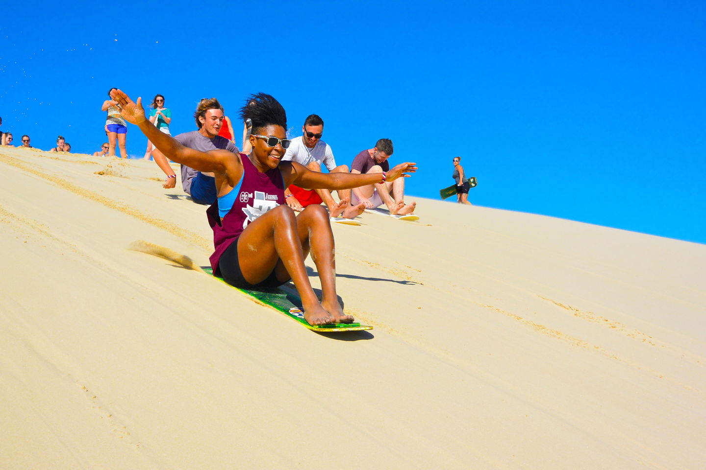 Traveller on sandboard in Sydney Australia