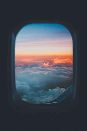 View from plane window at sunset