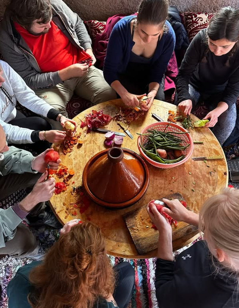 Group making a tagine together in Morocco