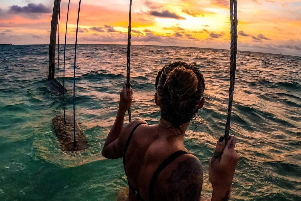 Sea swing at sunset