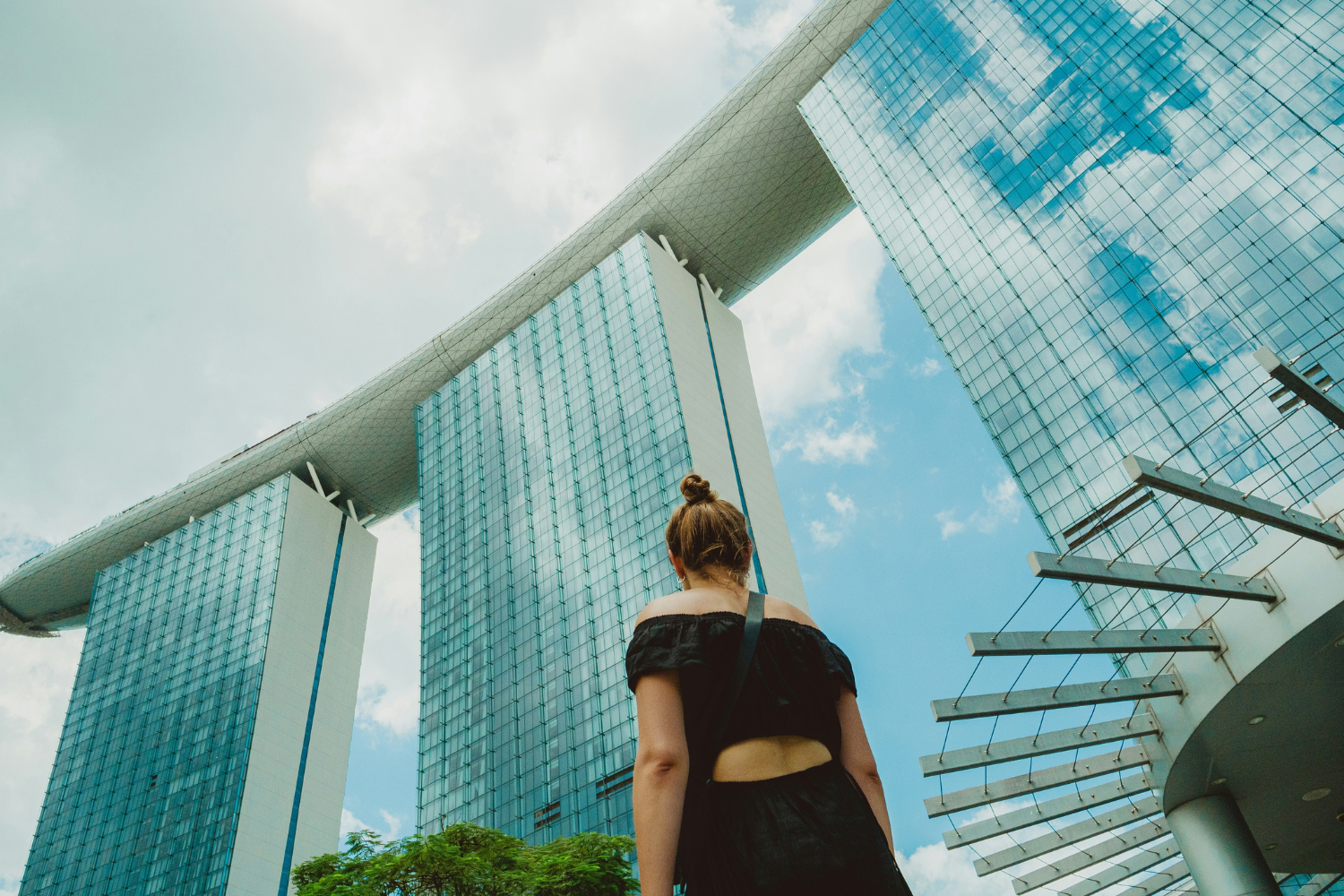  Women looking up at Marina Bay Sands resort in Singapore