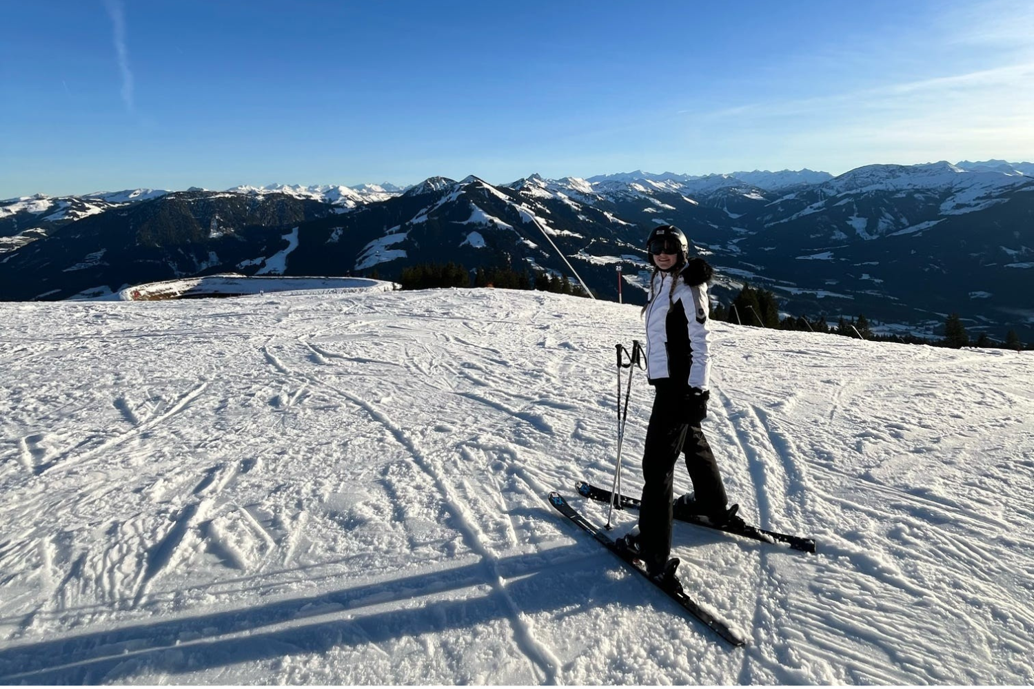 Traveller skiing in the snowy Austrian Alps on a group ski trip