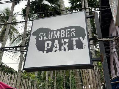Slumber Party Hostel Sign Phi Phi