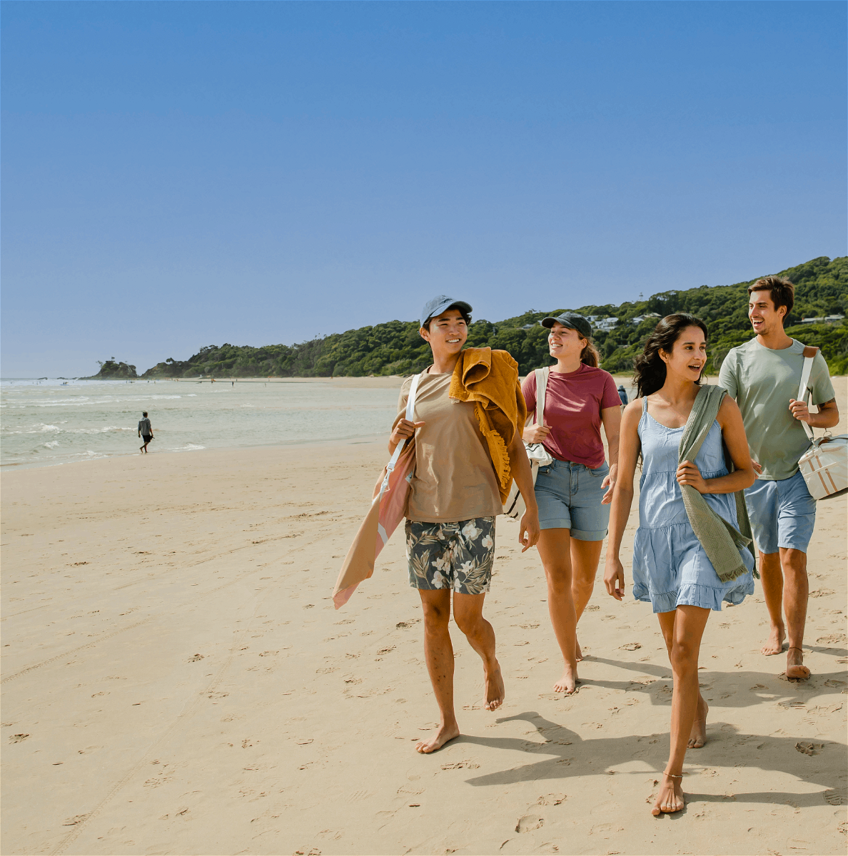 Group of travellers on a beach in New South Wales, Australia