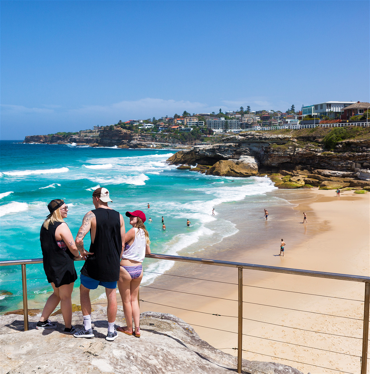 People looking over viewpoint at beach in Sydney Australia