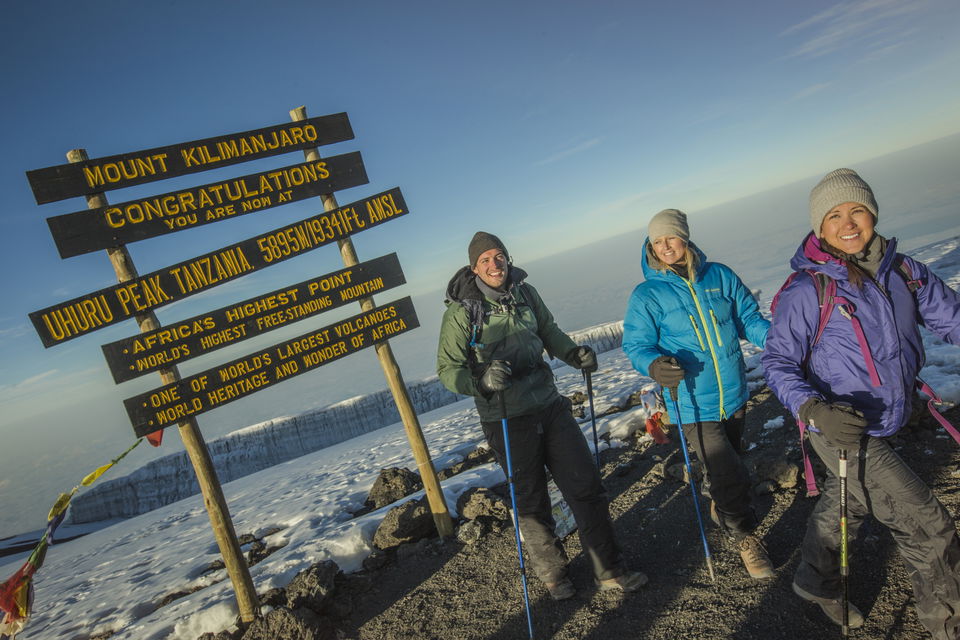 Trekking to the Uhuru Peak sign