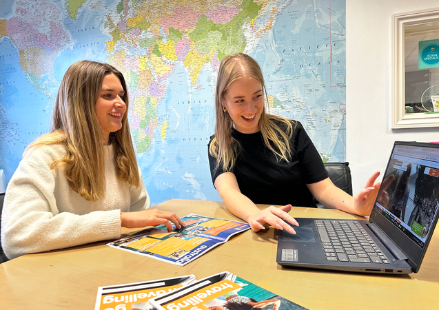Staff member showing a customer a product on the Gap 360 website
