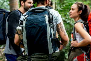 Three backpackers standing together