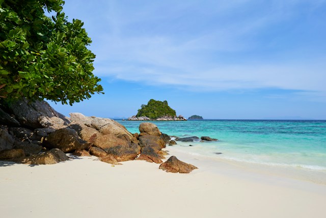 Pristine beach in Thailand with islands in the distance
