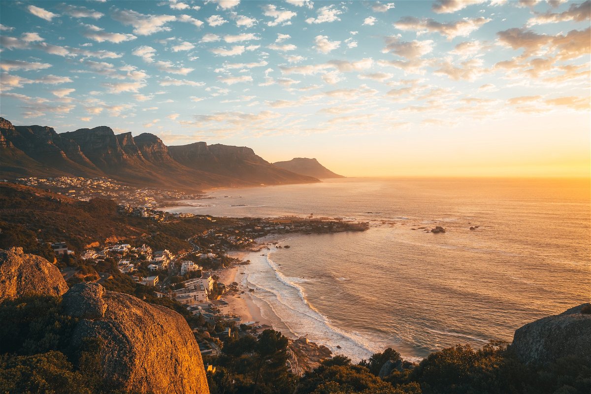 Aerial view of Cape Town, beaches and surrounding mountains at sunset