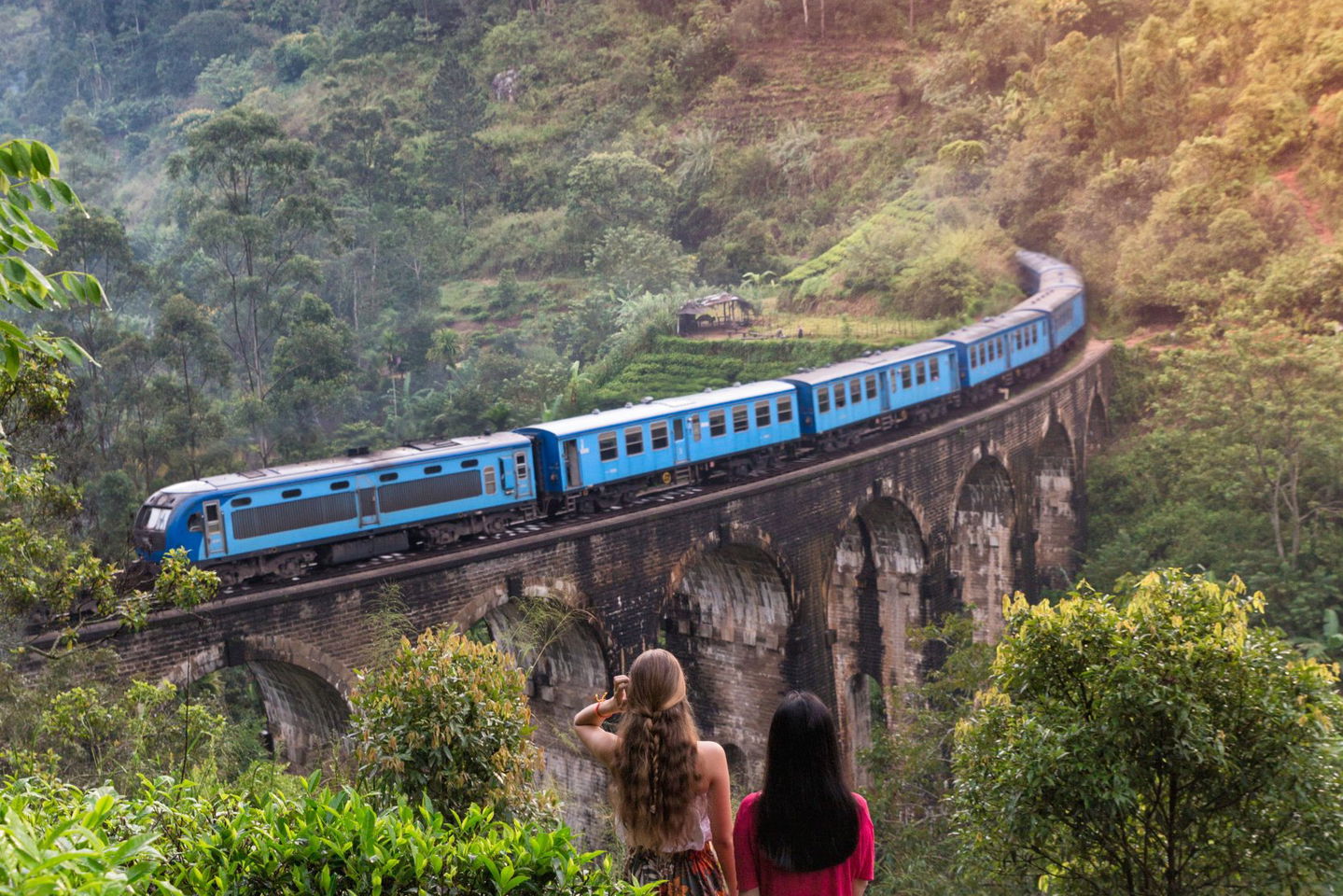 group travellers watching train in ella sri lanka nine arch bridge