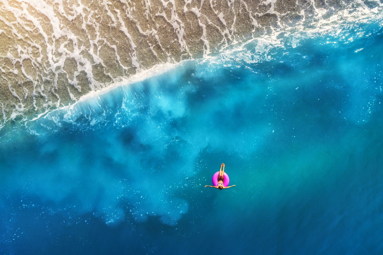Traveller relaxing in a inflatable ring off the coast of Turkey