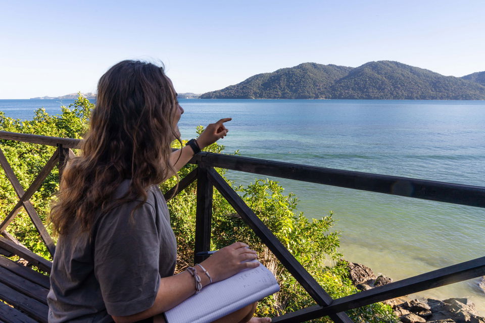 Person in turtle conservation pointing out into the sea