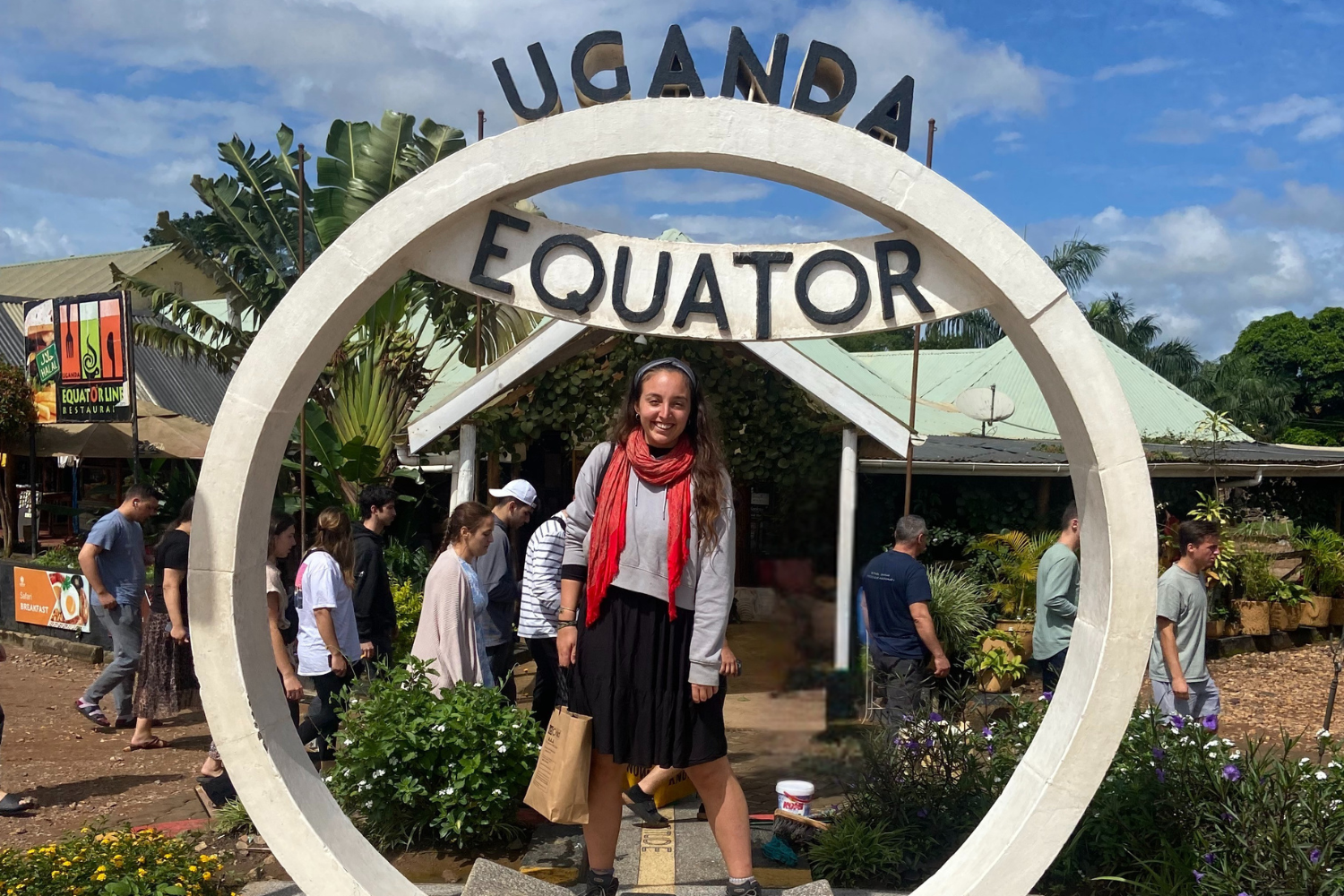 Traveller stood at Uganda Equator line, under photo spot in Uganda