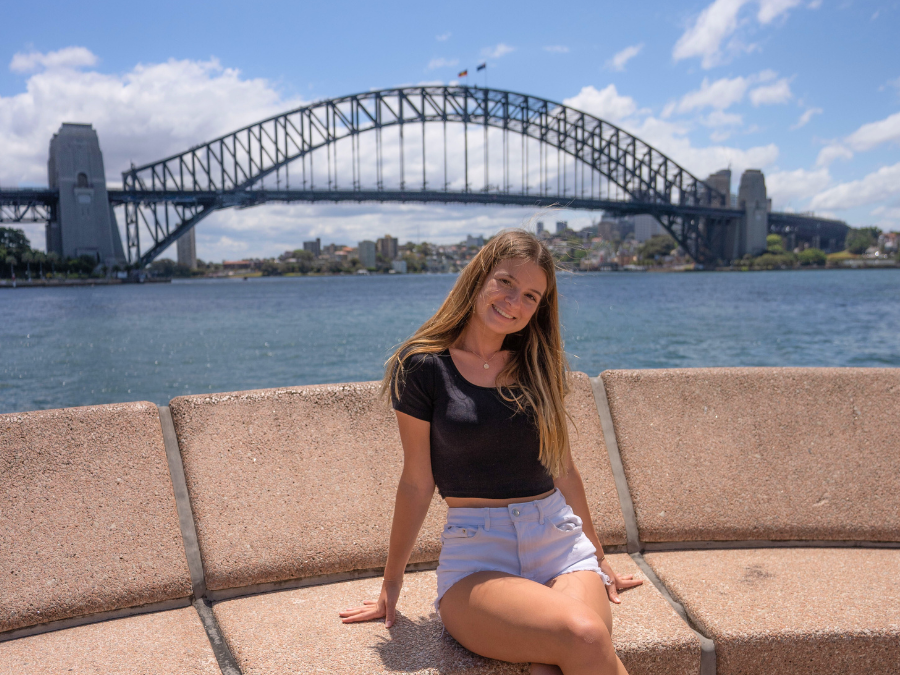 Traveller sat in front of Sydney Harbour Bridge