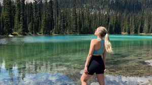 Solo traveller at clear lake in Canada