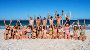 Group of travellers on beach in New South Wales