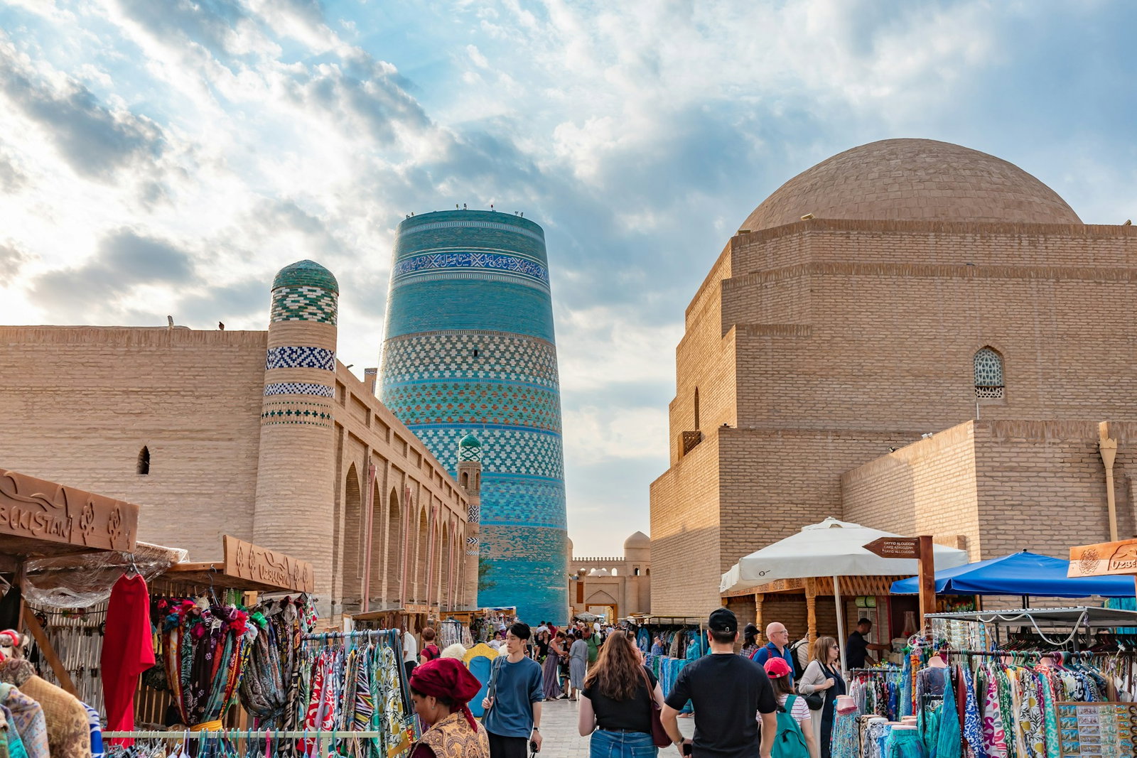 Khiva, Uzbekistan. Market and group travellers walking through 