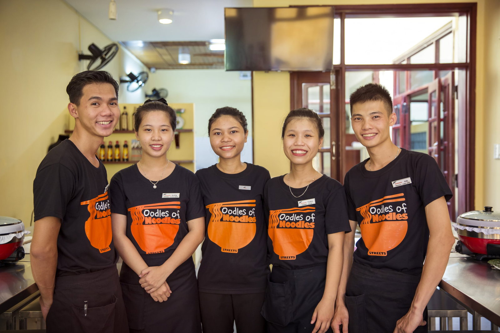 Oodles of Noodles staff members standing in their uniform