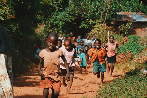 Group of happy children running