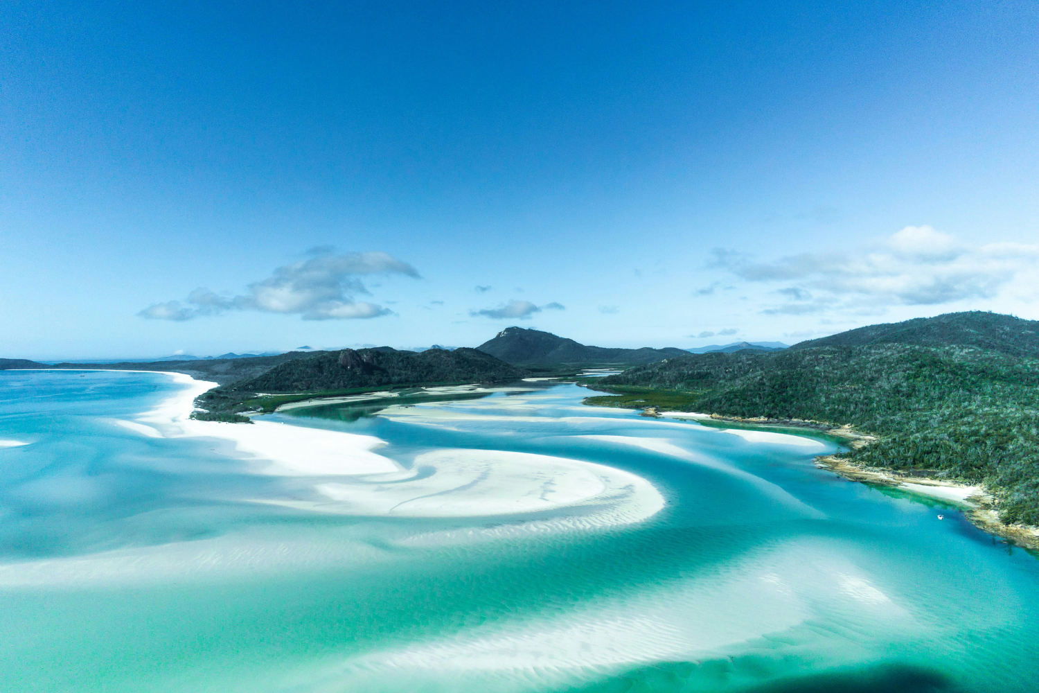 View of iconic swirling sand of Whitehaven Beach from viewpoint in the Whitsundays in Australia