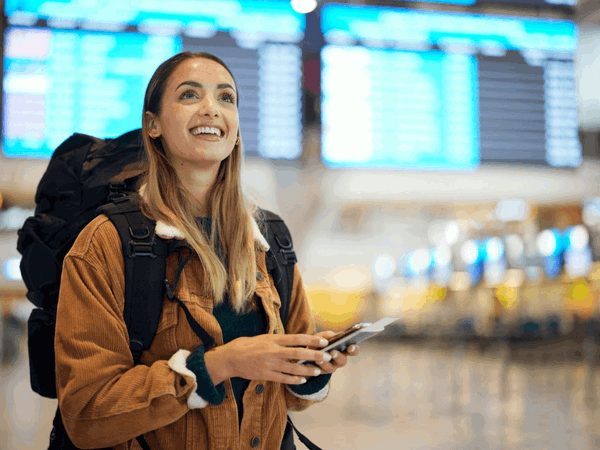 Group traveller with backpack in airport