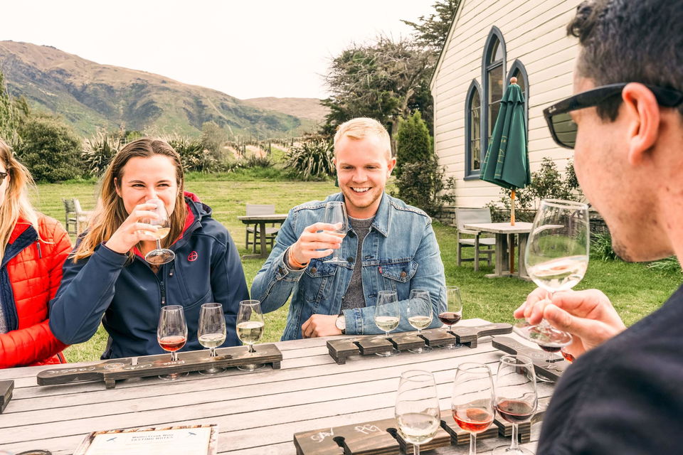 group sat drinking wine