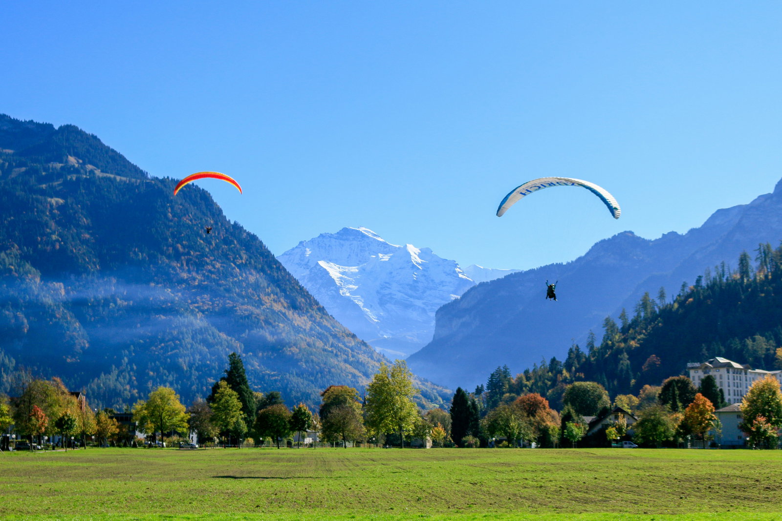 Paragliders near mountains in Switzerland