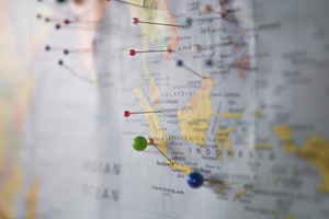A world map with pins in different locations